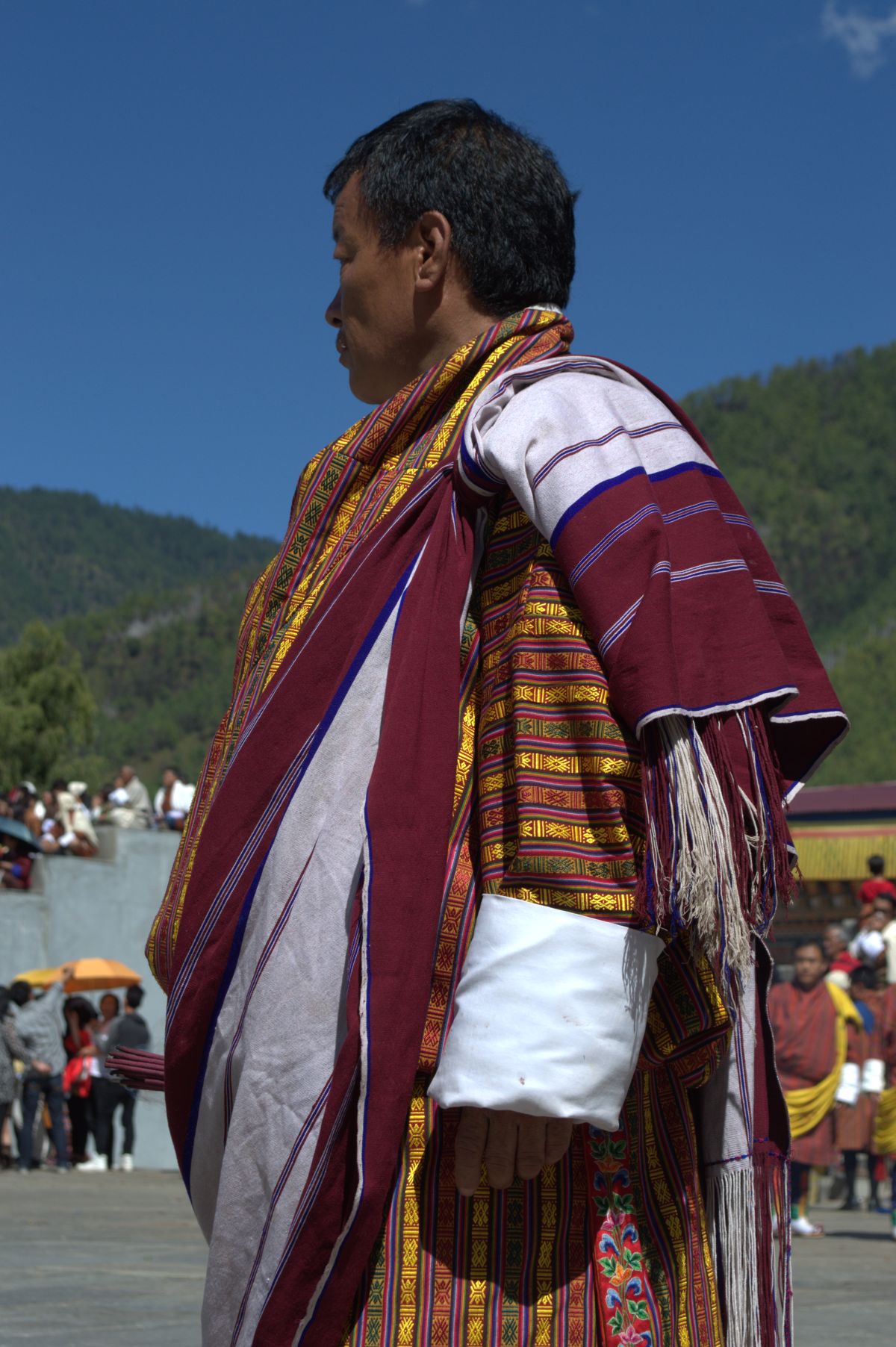 A man wears the Khamar Gup kabney standing at the Tendrel thang ground ...